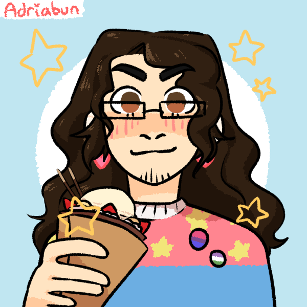 androgynous person with beard and long hair, wearing pride pins and holding a crepe