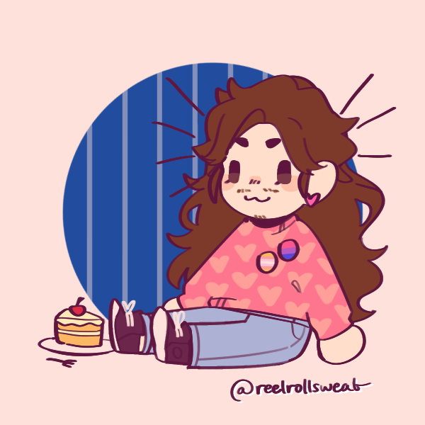 long-haired androgynous person sitting next to cake wearing pangender and bisexual pride pins
