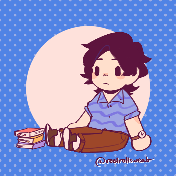 dark-haired boy in wavy blue shirt sitting next to pile of books