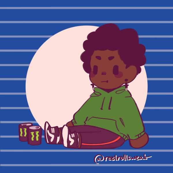 boy with afro in green hoodie sitting next to two cans of monster energy