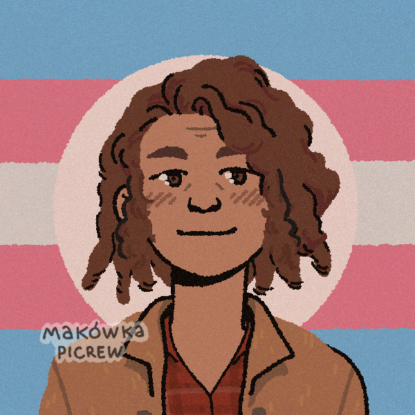 butch lesbian with dreadlocks in front of transgender flag