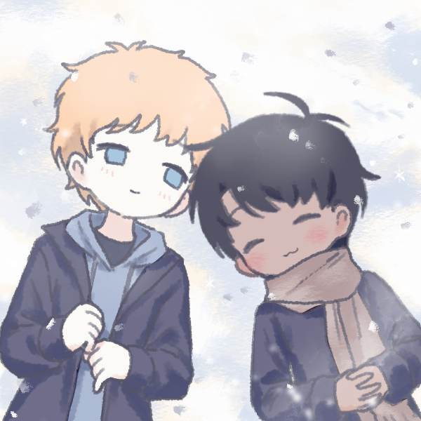 two boys lying in snow together